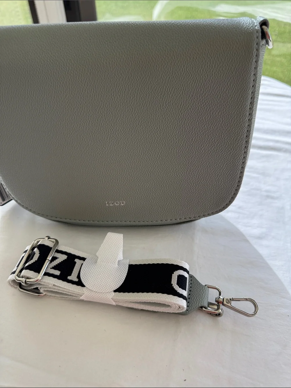 Izod Sage Pebbled Saddle Crossbody with Branded Strap